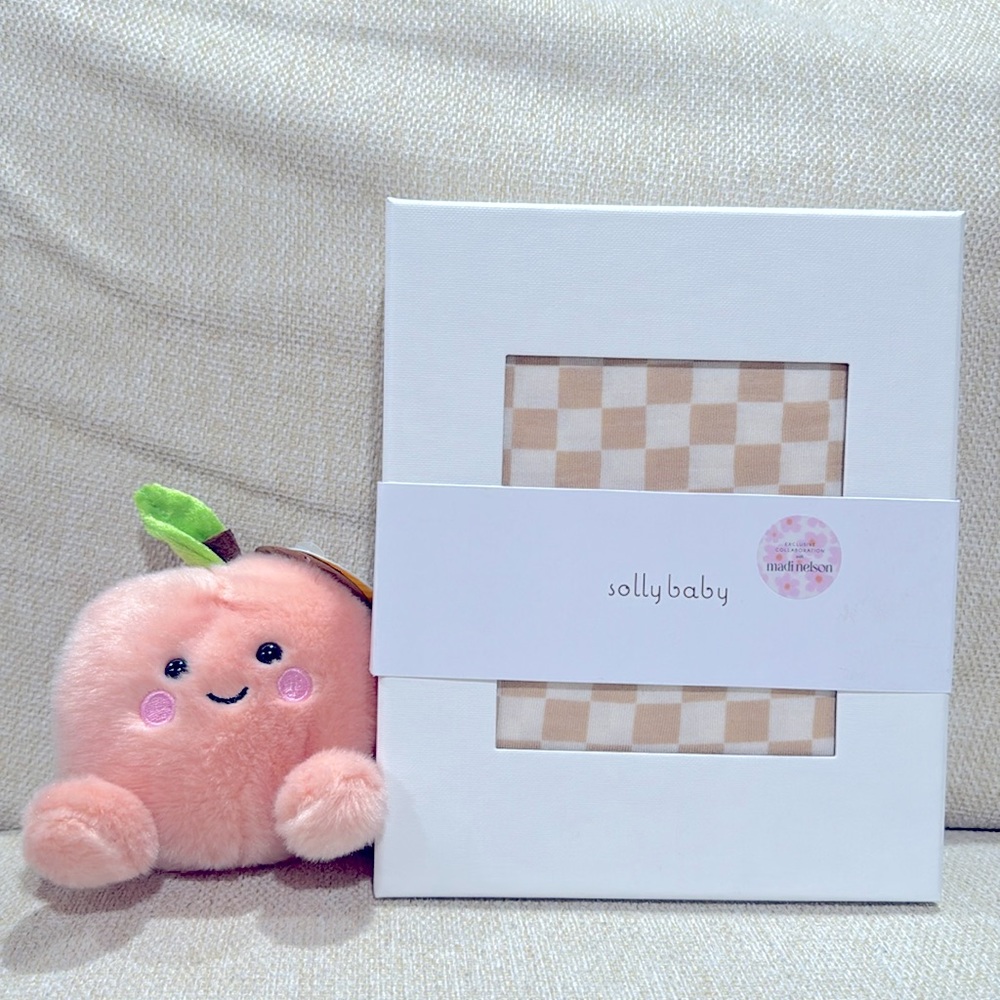 Madi Nelson x Solly Baby Collab wrap. Limited edition cream checkered print!